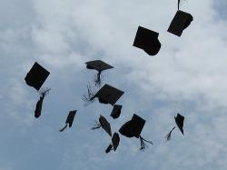 graduation hats flying